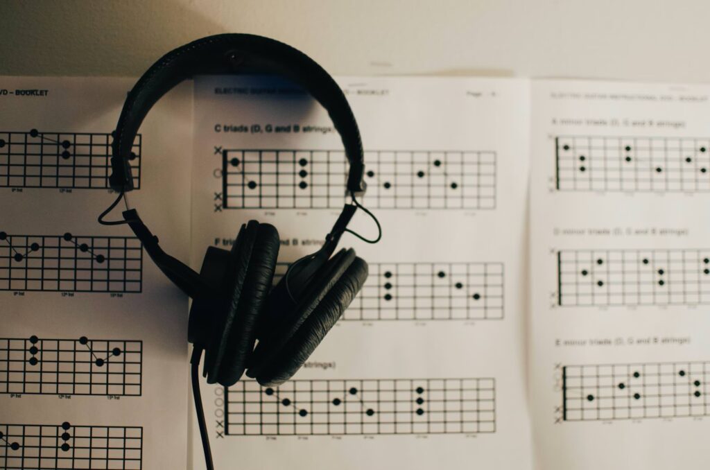 Headphones on top of a music theory textbook — courtesy of Kelly Sikkema.
