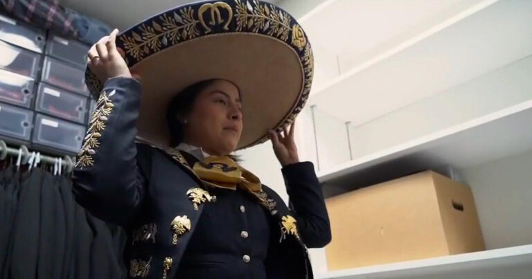 Woman in mariachi garb.